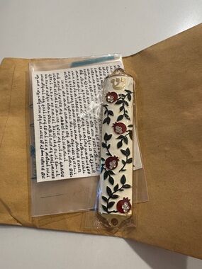 Mezuzah 3.5” long with pomegranate design and a scroll